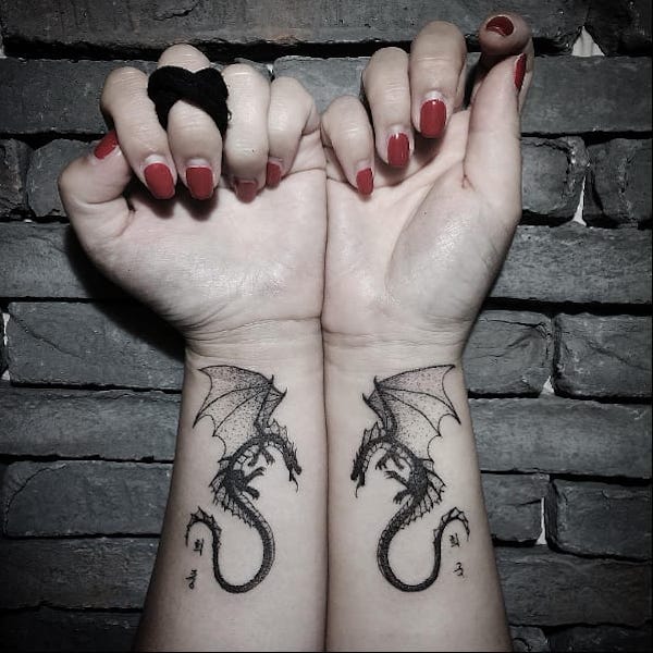 Small matching dragon tattoos