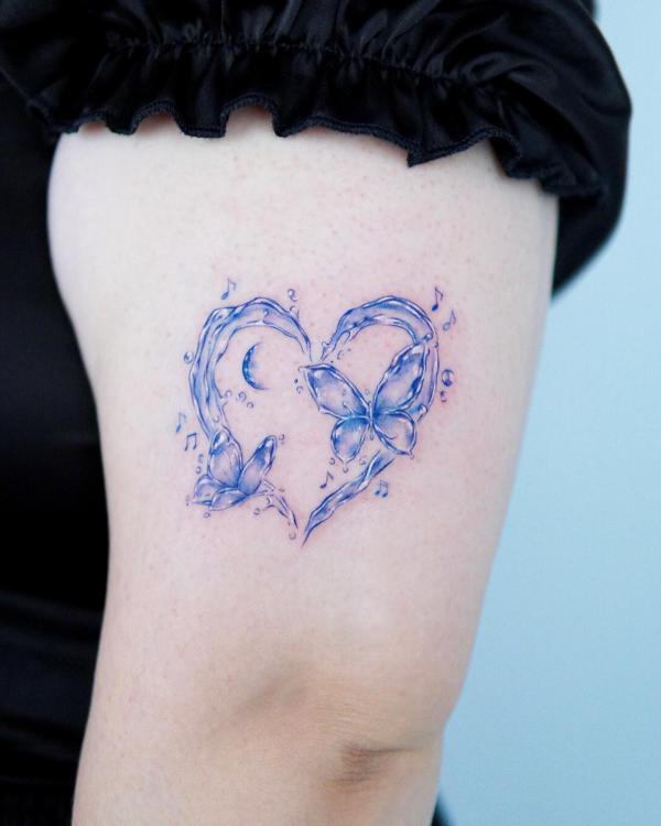 Blue water heart and floral thigh tattoo