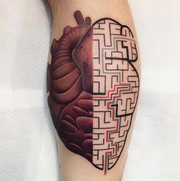 Half flesh half geometric heart tattoo