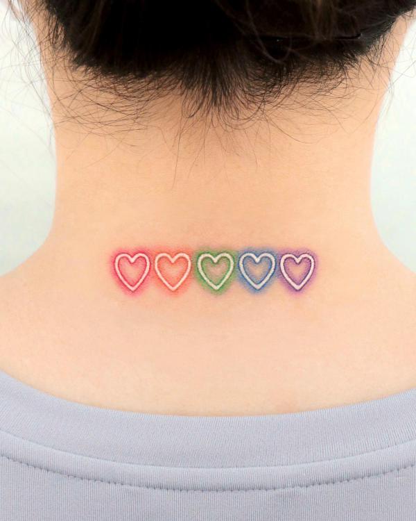 Heart outline neck tattoo