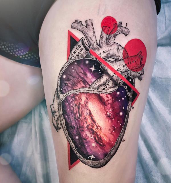 Heart space thigh tattoo