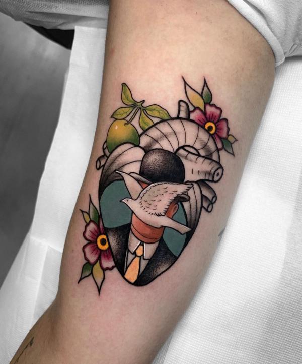 Neo traditional human heart tattoo