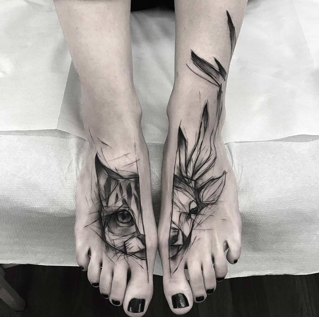 Tribal foot tattoo