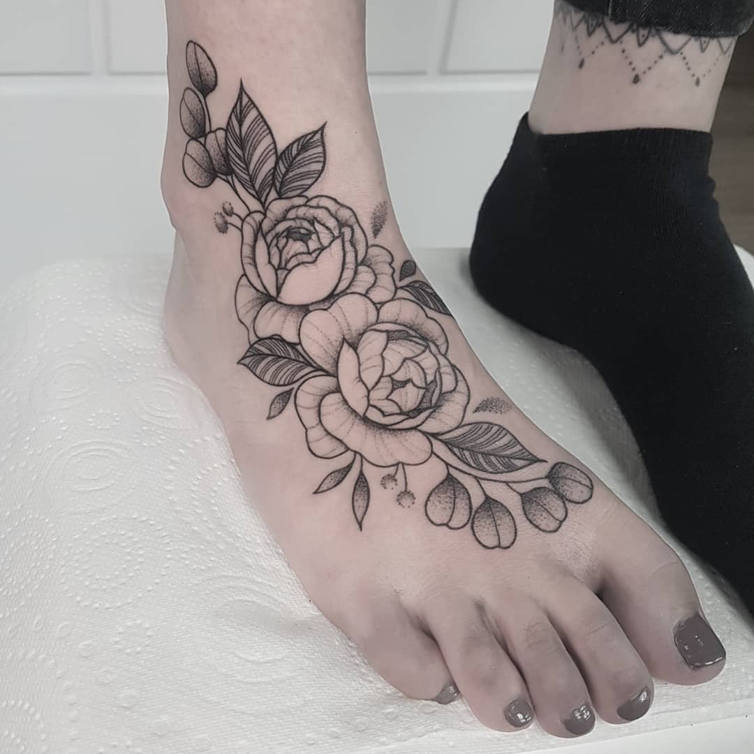 Mandala inspired foot tattoo looking like stock