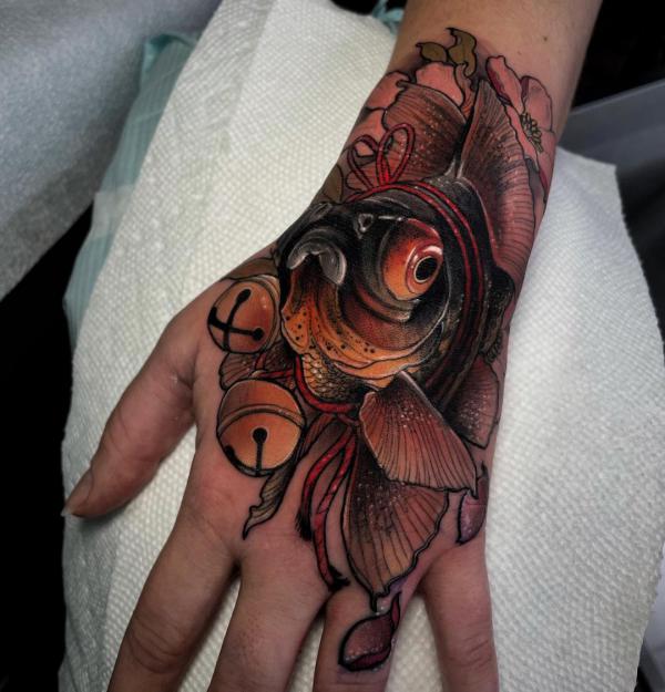 Goldfish hand tattoo neo traditional