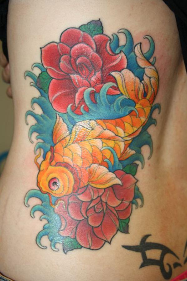 Koi fish and rose rib tattoo