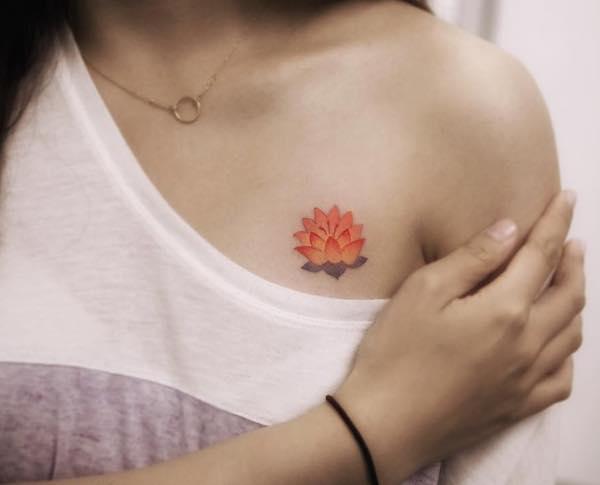 Small lotus chest tattoo