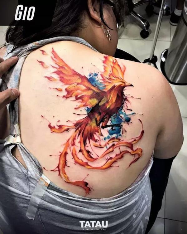 Watercolor tattoo pheonix on back for women
