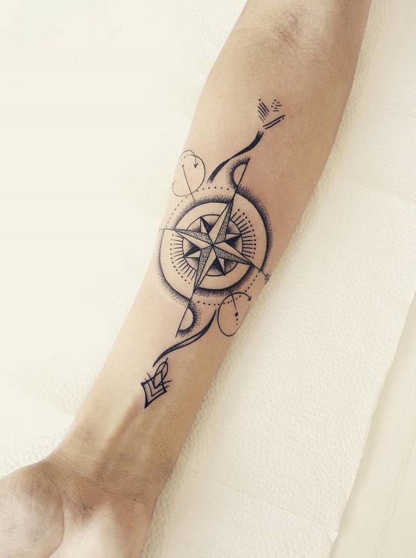 compass with feather tattoo designs