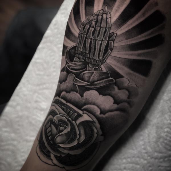 Praying hands with money rose tattoo