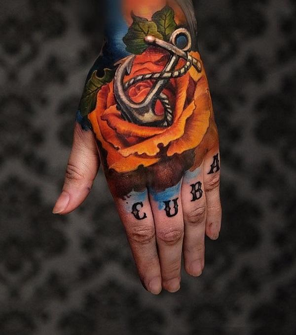 Rose and anchor hand tattoo