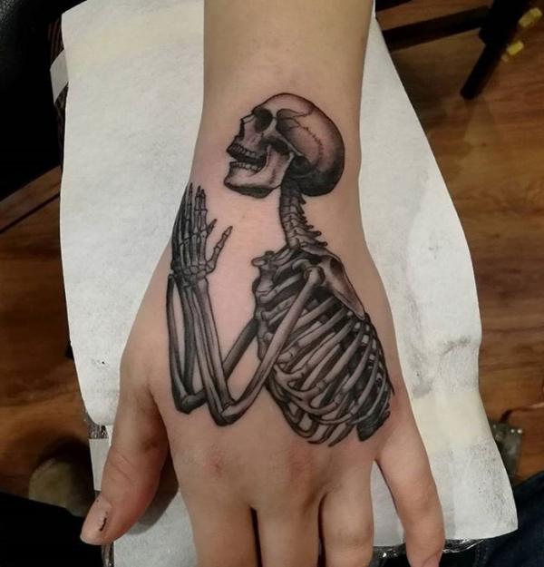 Skeleton with praying hands