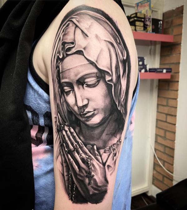 Virgin mary praying hands tattoo