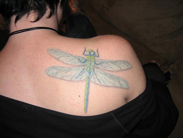 dragonfly tattoo White tattoo with a dragonfly on back