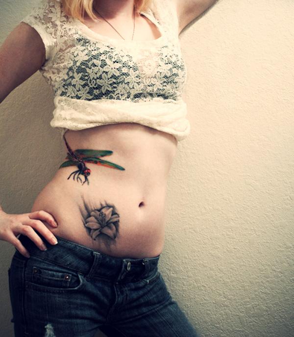 45 dragonfly tattoo A dragonfly is approaching the flower