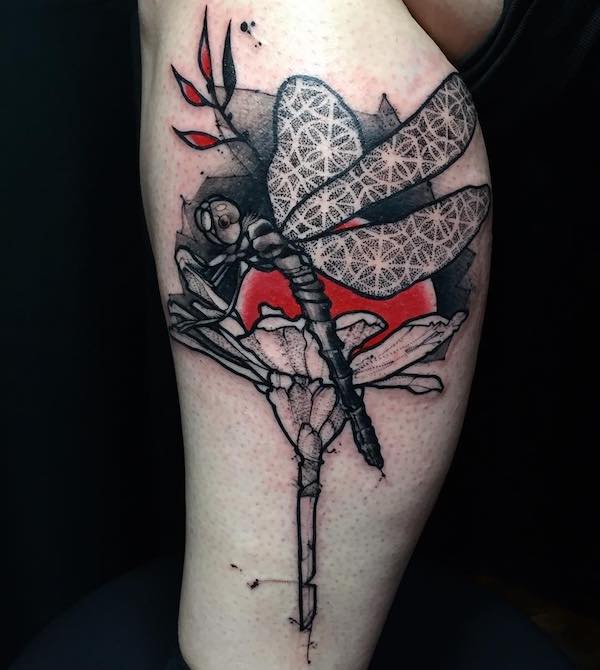 Thigh tattoo with a dragonfly on flower