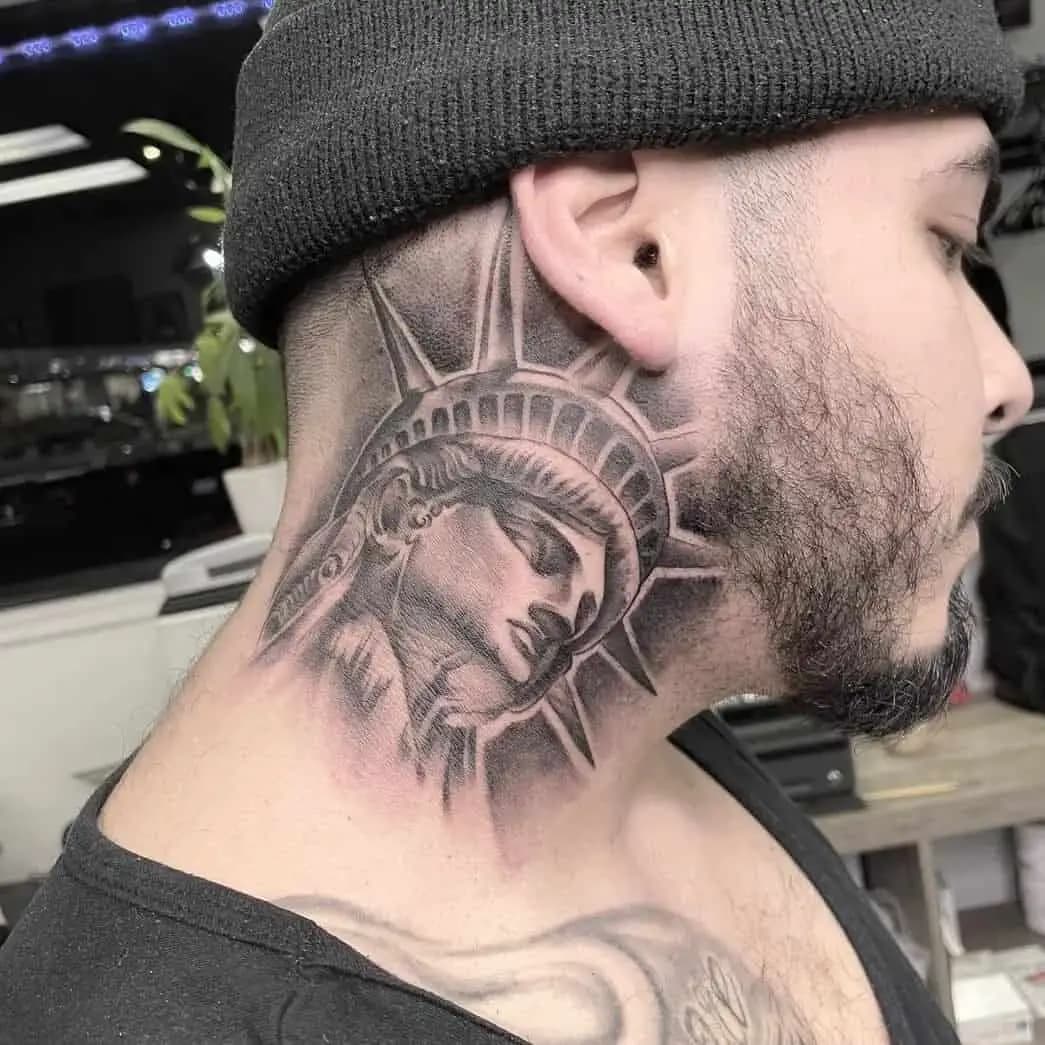 A Realistic Black and Grey Statue of Liberty Neck Tattoo A Realistic Black and Grey Statue of Liberty Neck Tattoo