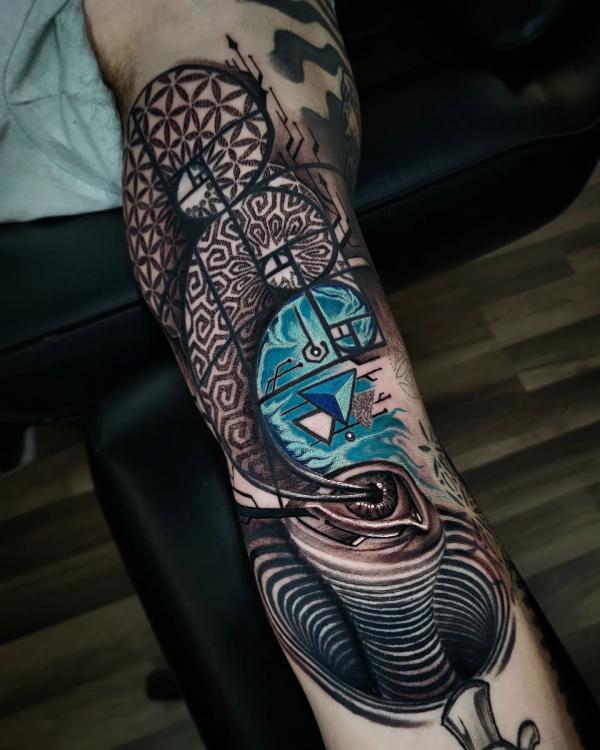 Cool Math Geometric patterns tattoo with an realistic eye