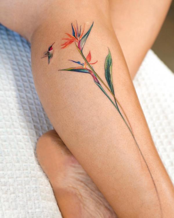 Small hummingbird and bird of paradise tattoo