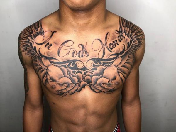 In gods hand tattoo