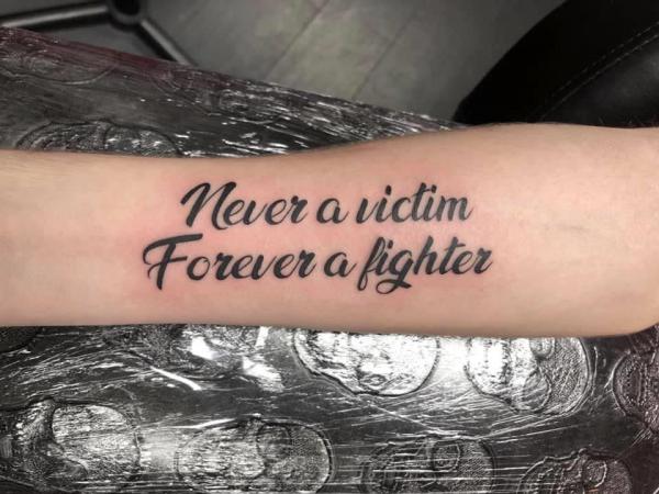 Never a victim forever a fighter tattoo