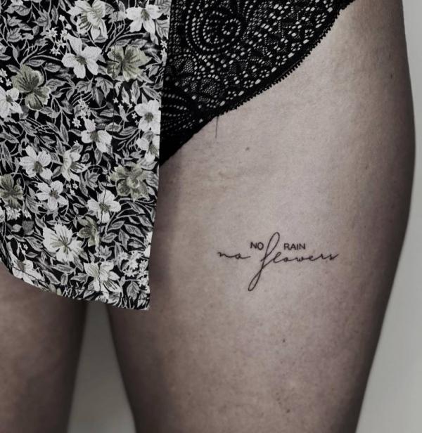 No rain no flowers tigh tattoo