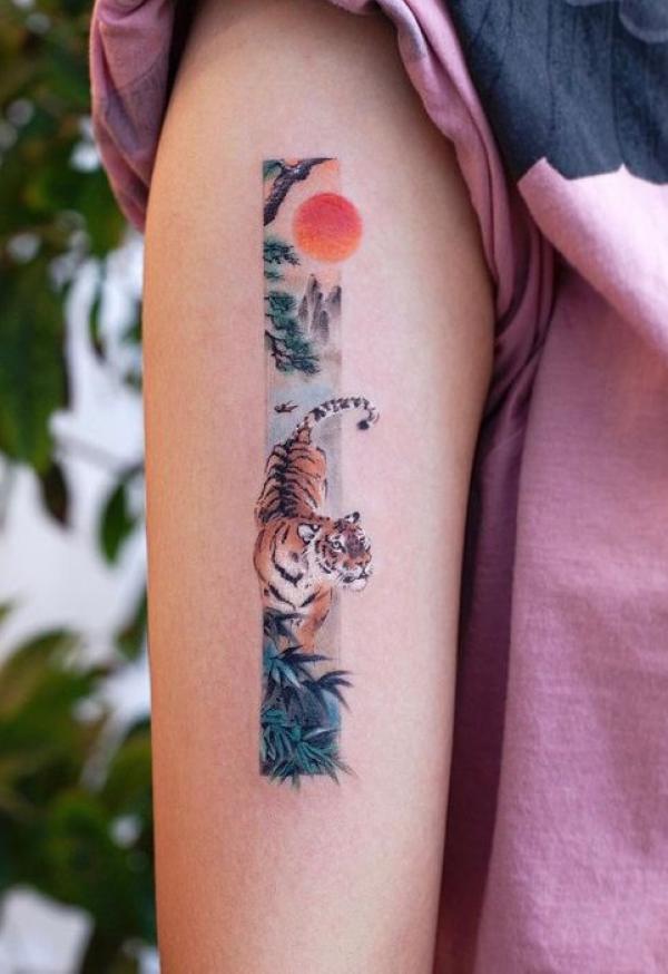 Small Japanese tiger and sun tattoo