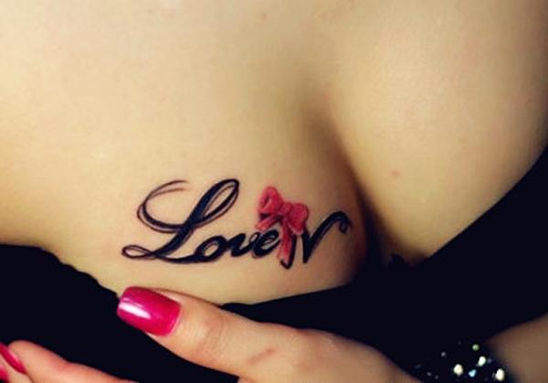 Love with bow chest tattoo