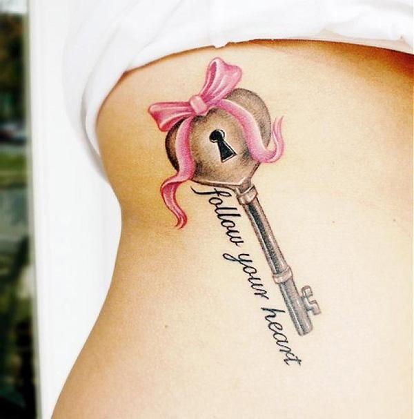 Key with pink bow tattoo with phrase - Follow your heart