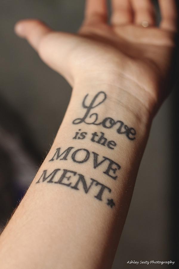 Love is the movement lettering tattoo
