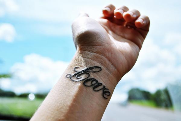  all you need is love wrist tattoo