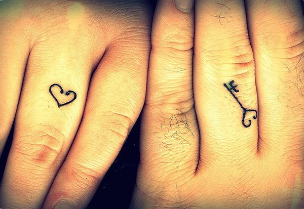 Love symbol and key finger matching tattoo