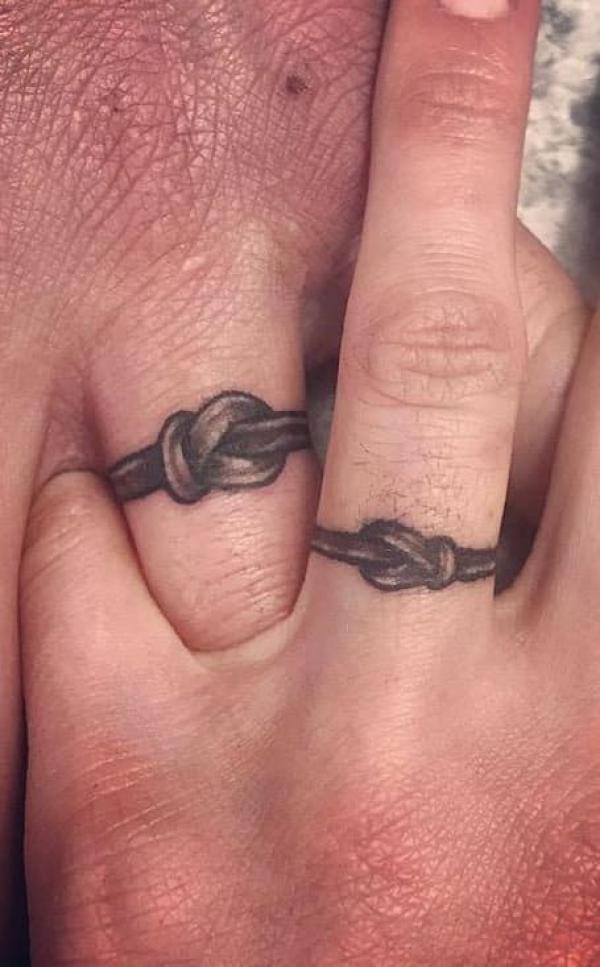 A pair of wedding rings finger tattoo