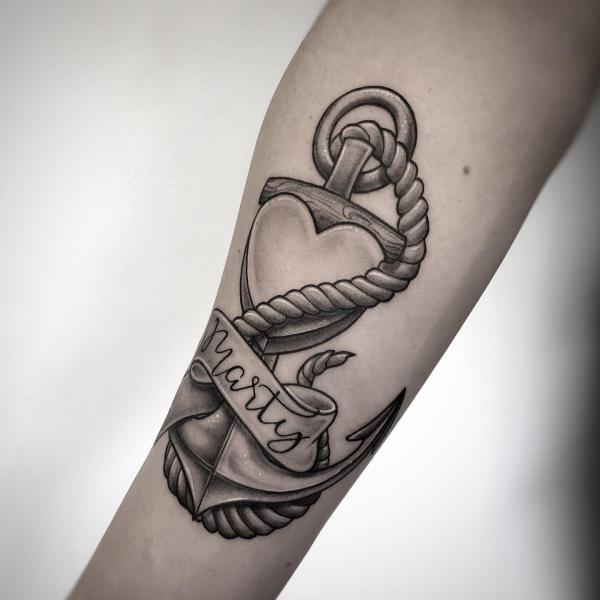 Anchor and heart with ribbon bearing the word Marty