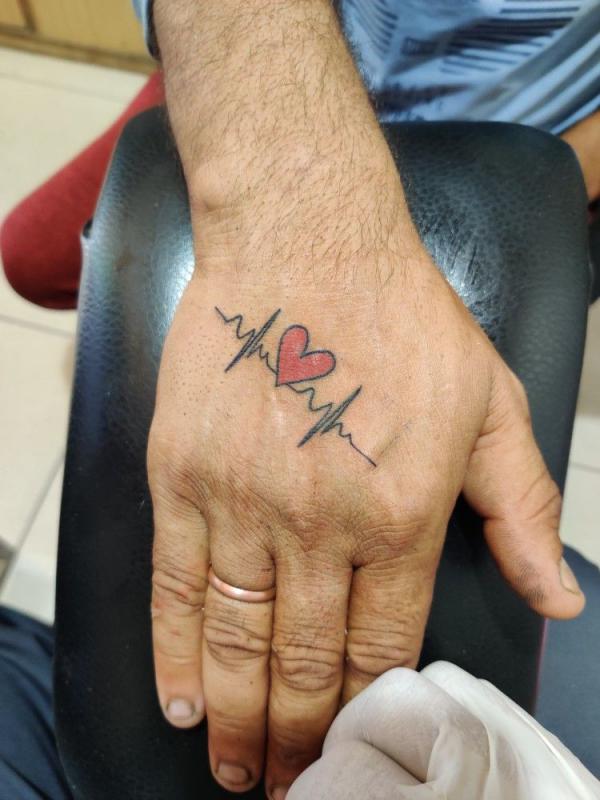 Heartbeat with a heart tattoo