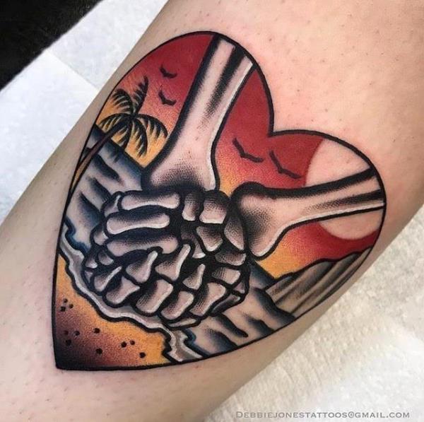 Til death do us part holding skeleton hands in heart shape symbol