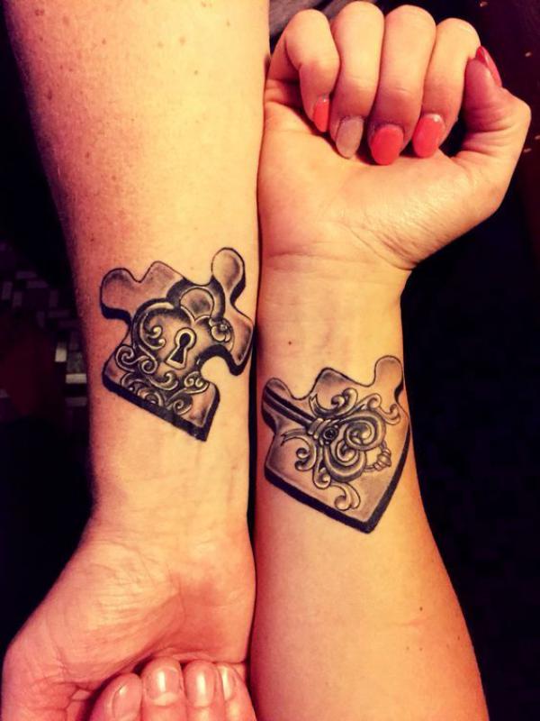 Two puzzle piece lock and key tattoo