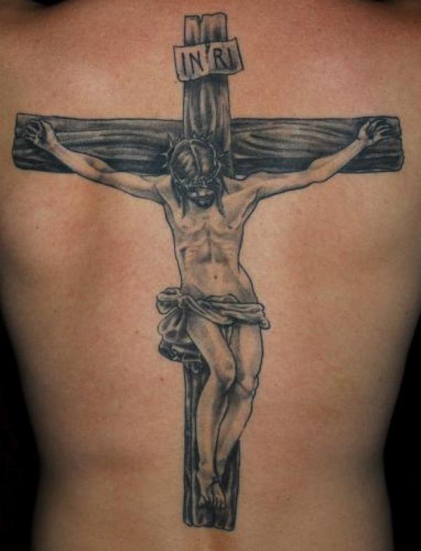 Black and grey Jesus tattoo on the inner forearm