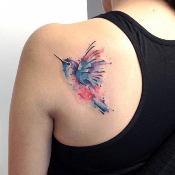Hummingbird watercolor tattoo on shoulder blade