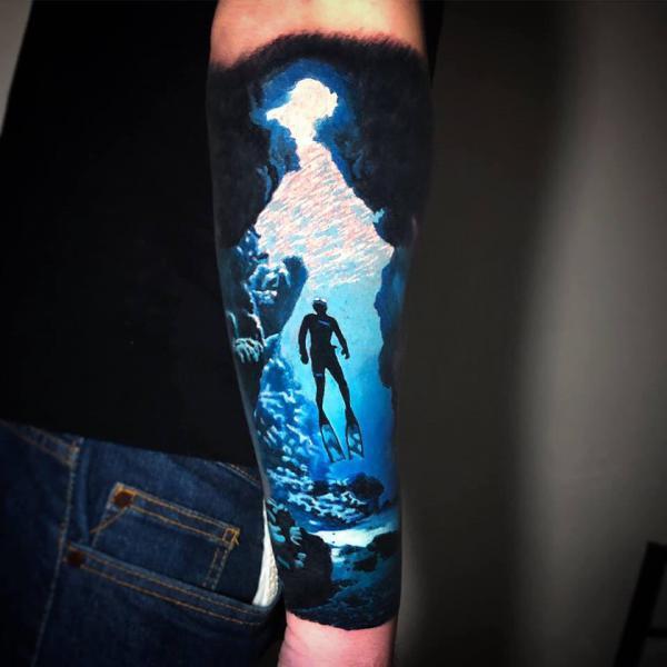 Incredible colored underwater forearm tattoo