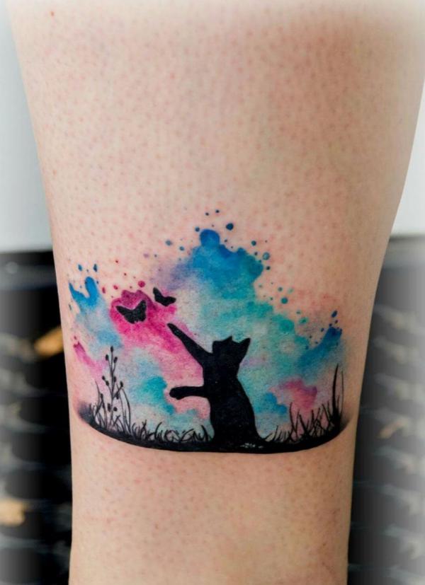 Silhouette cat and butterfly on watercolor backdrop