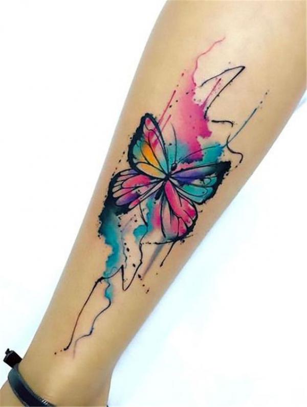Single watercolor butterfly tattoo on forearm