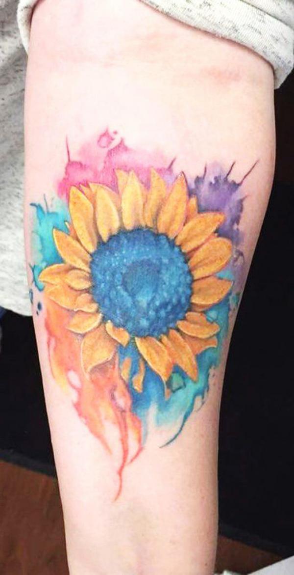Sunflower watercolor tattoo on forearm