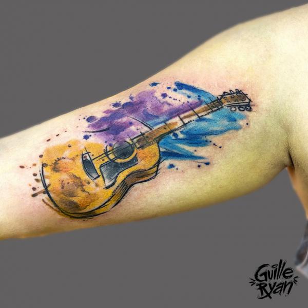 Watercolor Guitar bicep tattoo