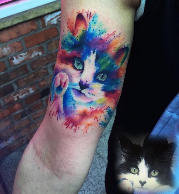 Watercolor cat bicep tattoo