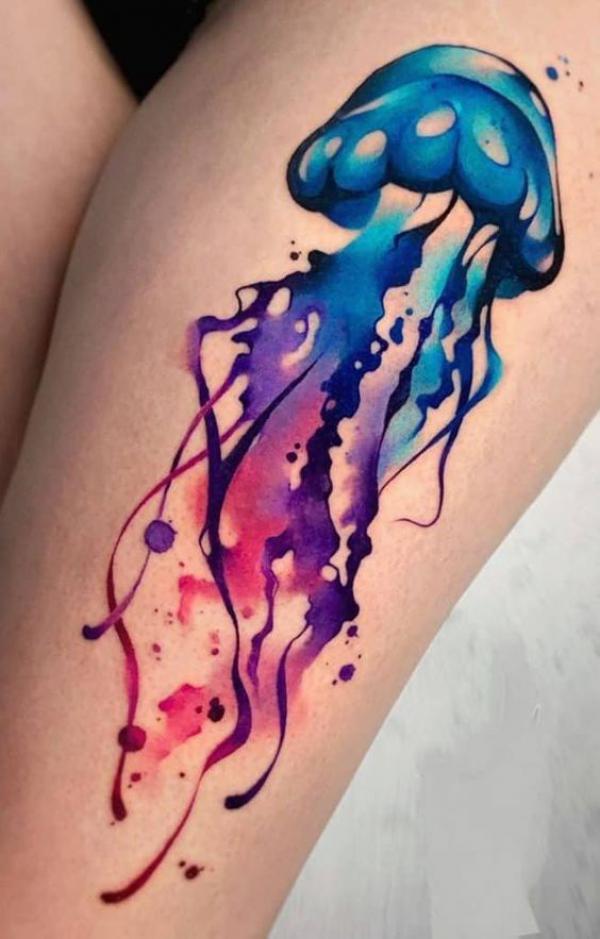 Watercolor jellyfish tattoo on thigh
