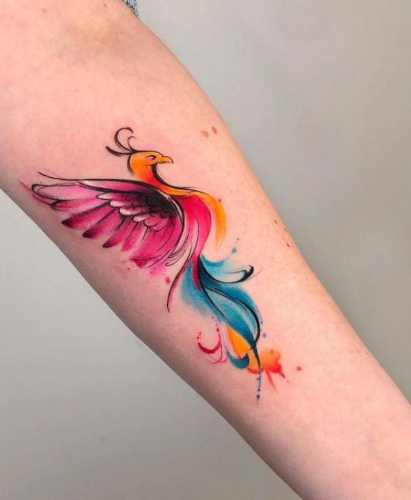 Watercolor phoenix tattoo on forearm