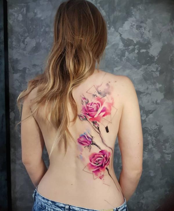 Watercolor pink rose tattoo on the side of back