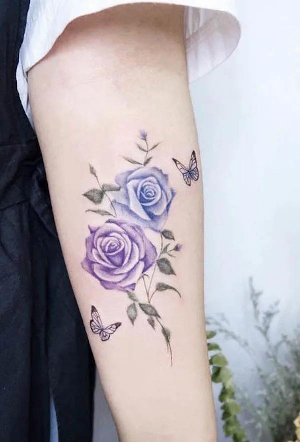 Watercolor pink roses with butterflies tattoo
