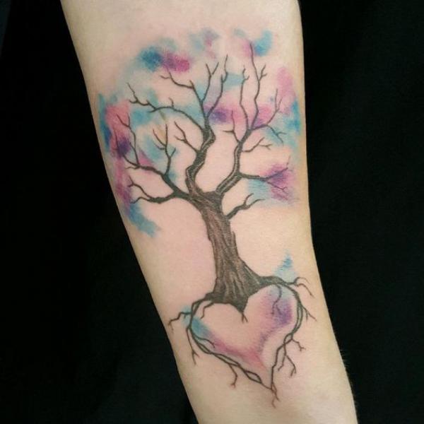 Watercolor tree forearm tattoo